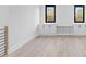 Bright bonus room with built-in shelving and hardwood floors at 555 Versailles Dr, Auburn, GA 30011