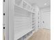 Built-in shelving and bench in a bright entryway at 555 Versailles Dr, Auburn, GA 30011