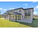 Modern home exterior with large windows and covered patio at 555 Versailles Dr, Auburn, GA 30011