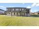 Modern home exterior with large windows and covered patio at 555 Versailles Dr, Auburn, GA 30011