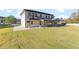 Modern home exterior with large windows and covered patio at 555 Versailles Dr, Auburn, GA 30011
