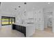 Modern kitchen with white cabinets, marble countertops, a large island, and high-end appliances at 555 Versailles Dr, Auburn, GA 30011