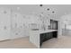 Modern kitchen with white cabinets, marble countertops, and a large island at 555 Versailles Dr, Auburn, GA 30011