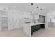 Modern kitchen with white cabinets, marble countertops, and stainless steel appliances at 555 Versailles Dr, Auburn, GA 30011