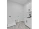 Laundry room with built-in cabinets and sink at 555 Versailles Dr, Auburn, GA 30011