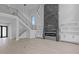 Spacious living room with a modern fireplace and large windows at 555 Versailles Dr, Auburn, GA 30011
