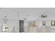 Open loft area with wood floors and built-in shelving at 555 Versailles Dr, Auburn, GA 30011