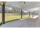 Covered patio with concrete flooring and backyard access at 555 Versailles Dr, Auburn, GA 30011