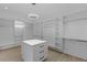Spacious walk-in closet with ample shelving and hanging space at 555 Versailles Dr, Auburn, GA 30011