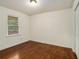 Bright bedroom with hardwood floors and a window with blinds at 2070 Brannen Se Rd, Atlanta, GA 30316