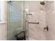 Walk-in shower with marble tile and built-in seat at 742 Mountainbrooke Cir, Stone Mountain, GA 30087