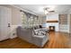 Bright living room featuring a fireplace, sectional sofa, and hardwood floors at 3766 Citation Dr, Decatur, GA 30034