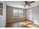 Spacious bedroom with hardwood floors, large window, and built-in closet at 3766 Citation Dr, Decatur, GA 30034