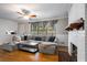 Cozy living room featuring a fireplace, hardwood floors, and large windows at 3766 Citation Dr, Decatur, GA 30034