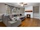 Cozy living room featuring a fireplace, hardwood floors, and large windows at 3766 Citation Dr, Decatur, GA 30034