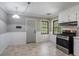 Eat-in kitchen with stainless steel appliances and white cabinets at 3766 Citation Dr, Decatur, GA 30034