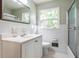 Clean bathroom with white tile and a shower/tub combo at 3766 Citation Dr, Decatur, GA 30034