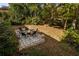 Elevated view of a stone patio with fire pit and surrounding landscaping at 3766 Citation Dr, Decatur, GA 30034