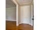 Bright entryway with hardwood floors and a closet with bifold doors at 3766 Citation Dr, Decatur, GA 30034