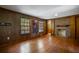 Finished basement with hardwood floors, brick fireplace and access to bathroom at 3766 Citation Dr, Decatur, GA 30034