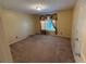 Spacious bedroom with neutral walls and carpet at 1833 River Shoals Ne Dr, Conyers, GA 30012