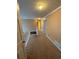 Upper level hallway with carpeted floors and multiple doors leading to bedrooms at 1833 River Shoals Ne Dr, Conyers, GA 30012