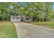 Front view of a charming house with a two-car garage at 135 Hitchcock Dr, Villa Rica, GA 30180