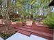 Brick staircase leads to a serene backyard patio area at 1473 Mahogany Chase Nw, Acworth, GA 30101