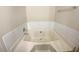 Bathroom with corner bathtub and tile surround at 3781 Harvest Dr, Decatur, GA 30034