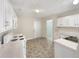 Kitchen with white cabinets and appliances at 3781 Harvest Dr, Decatur, GA 30034