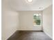 Bright bedroom featuring grey carpet and window at 3781 Harvest Dr, Decatur, GA 30034