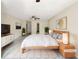 Virtually staged main bedroom with large bed and TV at 3781 Harvest Dr, Decatur, GA 30034