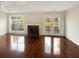 Bright living room with hardwood floors, fireplace, and French doors leading to the backyard at 3781 Harvest Dr, Decatur, GA 30034