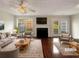 Virtually staged living room with fireplace and hardwood floors at 3781 Harvest Dr, Decatur, GA 30034