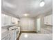 Kitchen with white cabinets, microwave, and island at 3781 Harvest Dr, Decatur, GA 30034