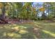 Private backyard with garden, playset, and trampoline at 101 Lake Somerset Nw Crst, Marietta, GA 30064