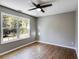 Empty bedroom with wood-look flooring and large window at 364 Whooping Creek Rd, Carrollton, GA 30116