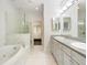 Elegant bathroom with double vanity, soaking tub, and walk-in shower at 53 Honour Nw Ave, Atlanta, GA 30305