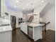 Modern kitchen with white cabinets, stainless steel appliances, and a large island at 53 Honour Nw Ave, Atlanta, GA 30305