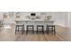 Kitchen island with seating for four and white quartz countertop at 20 Black Rock Rdg, Sharpsburg, GA 30277