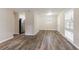 Open dining area with wood-look floors and kitchen access at 3851 Bonnie Se Ln, Atlanta, GA 30354