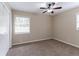 Bright bedroom with neutral walls, carpet, ceiling fan and ample closet space at 3851 Bonnie Se Ln, Atlanta, GA 30354