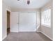 Well-lit bedroom with carpet, double closets and access to hallway at 3851 Bonnie Se Ln, Atlanta, GA 30354
