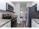 Well-equipped kitchen, featuring stainless steel appliances and granite countertops at 3851 Bonnie Se Ln, Atlanta, GA 30354