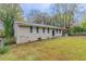 Brick ranch house with a driveway and landscaped yard at 3851 Bonnie Se Ln, Atlanta, GA 30354