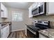 Updated kitchen with stainless steel appliances and granite countertops at 3851 Bonnie Se Ln, Atlanta, GA 30354