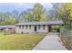 Brick ranch house with a driveway and landscaped yard at 3851 Bonnie Se Ln, Atlanta, GA 30354