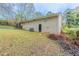 View of the home's backyard, showing a grassy area and trees at 3851 Bonnie Se Ln, Atlanta, GA 30354