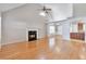 Spacious living room with hardwood floors, fireplace, and high ceilings at 4483 Prather Pass Dr, Loganville, GA 30052