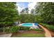 Community swimming pool surrounded by lush landscaping at 3650 Ashford Dunwoody Ne Rd # 802, Brookhaven, GA 30319